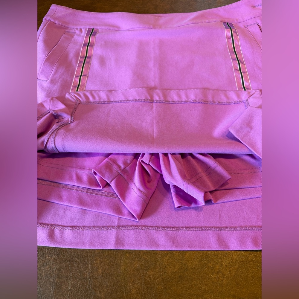 EP Pro misses stretch skort, pink w/ ribbon trim, pockets. Size 12.